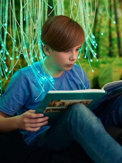 A young boy reading a book.